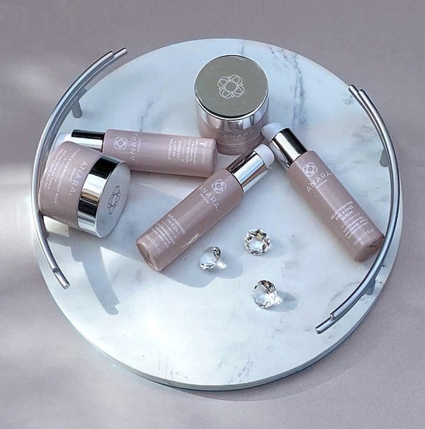 The 5 Anara Skincare products on a white marble tray