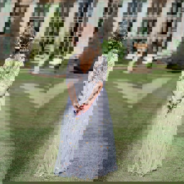 Pretty flower girl in wedding grounds