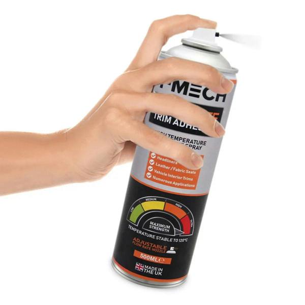 Silver spray can for trim adhesive, featuring adjustable nozzle, hand gripping can, and temperature stability indicator