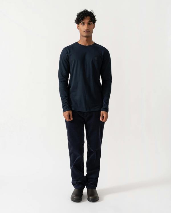 Man wearing BOSS Orange Tacks Mens Long Sleeve T-Shirt with logo Patch - Dark Blue 404