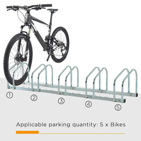 Silver bike parking rack with five numbered slots, holding a black bicycle