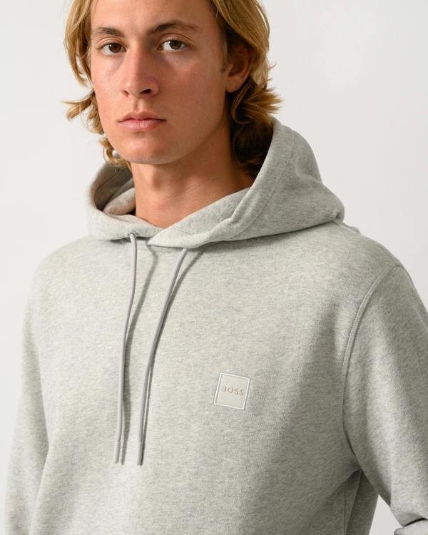 close up of a model wearing a BOSS Orange Wetalk Mens Pullover Hoodie With Logo Patch in Open Grey 086