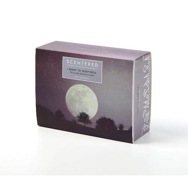 Scentered Sleep Well aromatherapy gift set box featuring moonlit night sky design with trees and moon illustration on purple packaging.