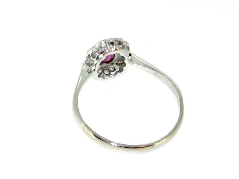 Vintage Tom A platinum ruby and diamond cluster ring