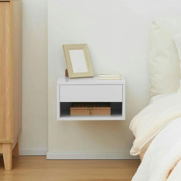 White floating bedside table with open shelf compartments and clean wall-mounted frame