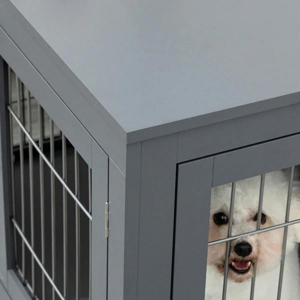 Grey dog crate corner with wire-bar side door and metal hinge latch