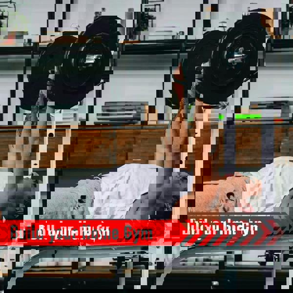 Body Revolution 1.2m EZ Barbell Bar with Spinlock Collars, showcasing a lifter performing bench press in a modern home gym setting