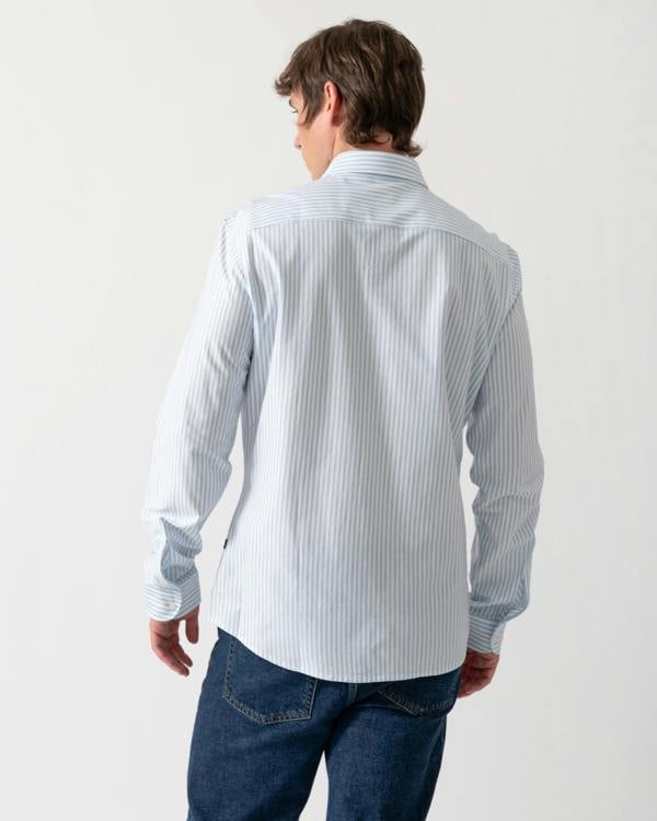 back of a model wearing a BOSS Orange Mysoft Mens Slim-Fit Shirt in Melange Cotton Jersey in Open Blue 461
