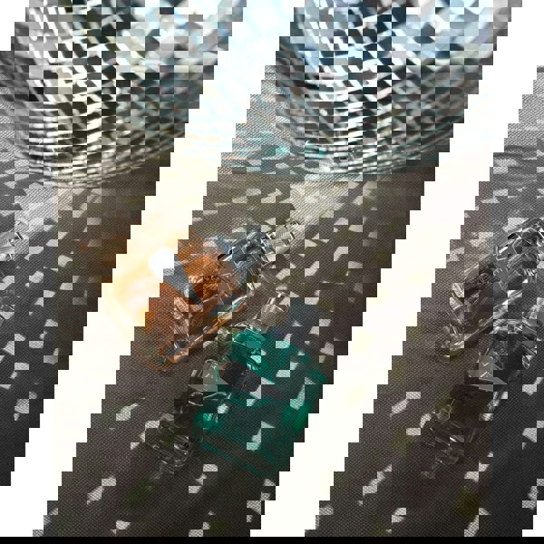 Sapil Rave Women Eau de Parfum bottle with disco light reflections