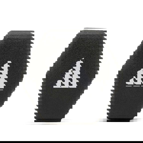 Black hexagonal weight with Adidas logo on a white background