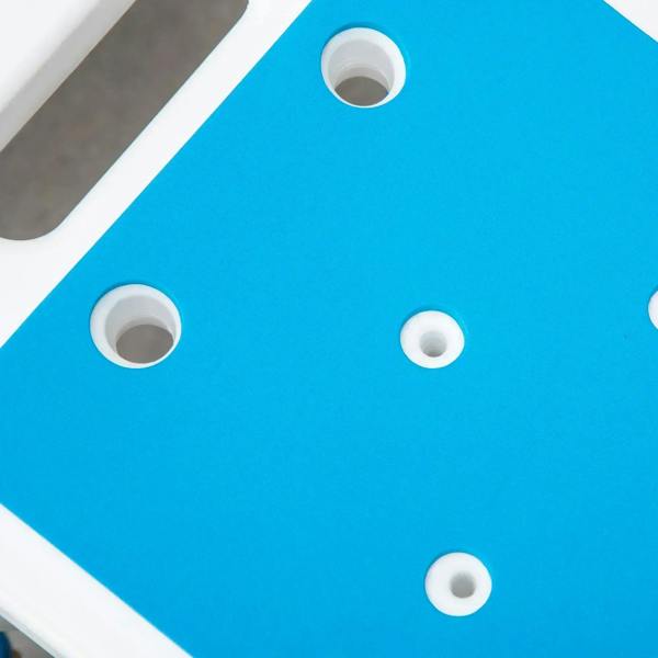 Blue EVA padded seat with white drain holes and circular openings