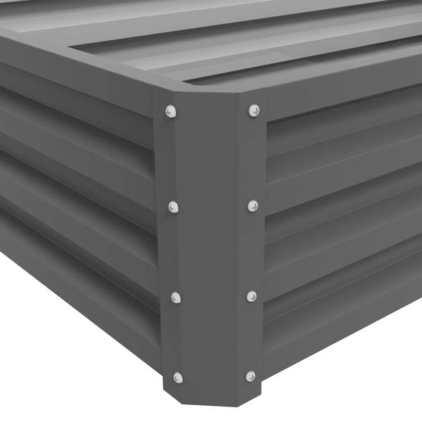 Light grey corner of raised garden bed with bolted posts and horizontal slats
