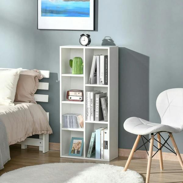 White seven-cube bookcase with open cube shelves for storing books and decorative items.