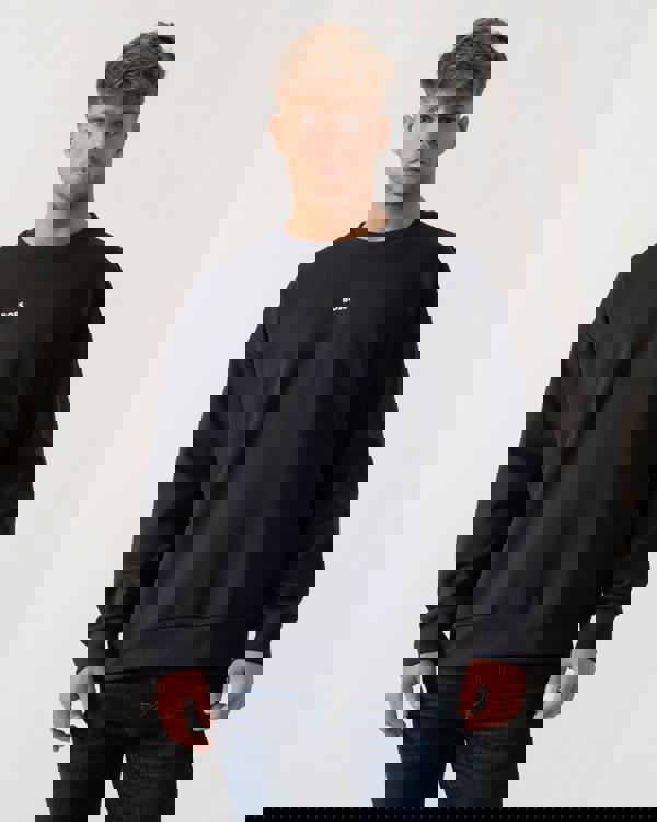 Model wearing BOSS Green Stenson Mens Crew Neck Sweatshirt in Dark Blue 403 - Main