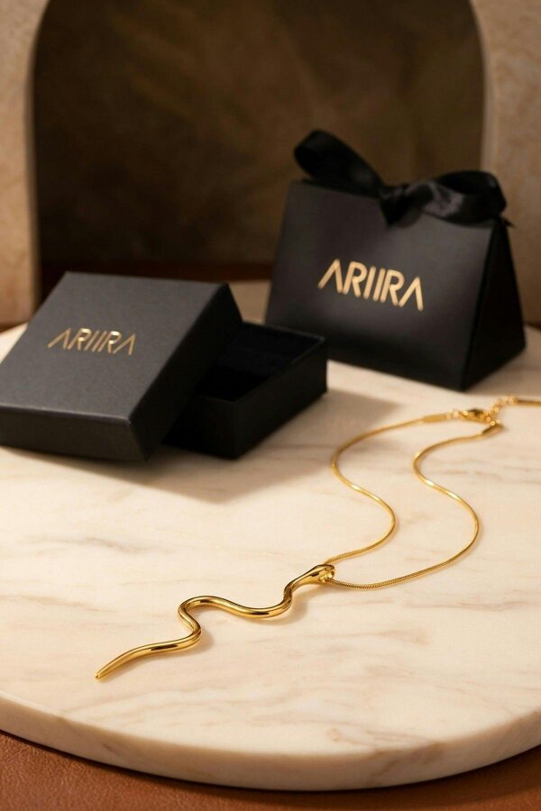 ARIIRA India Gold Tone Wavy Serpent Pendant