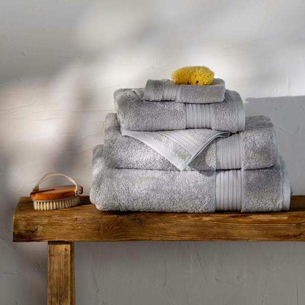 Light Grey Egyptian Cotton Face Cloth styled in a bedroom | Soak and Sleep