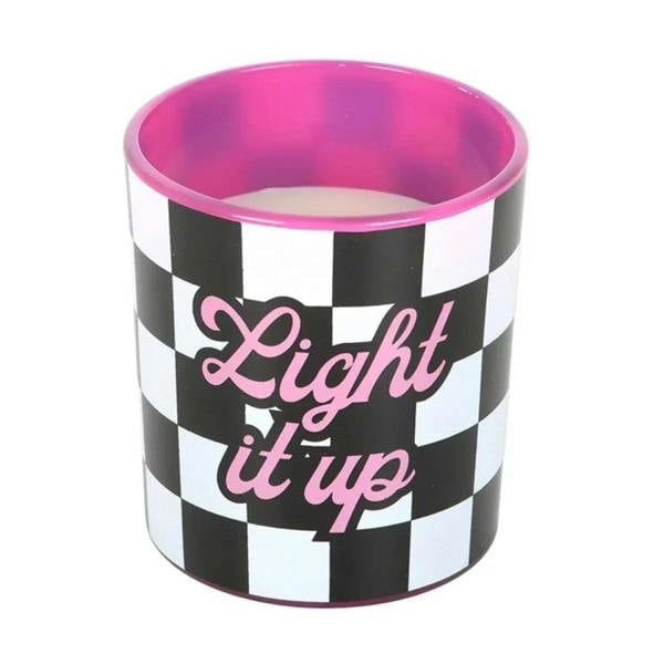 Black-and-white checkered scented candle jar with pink wax surface