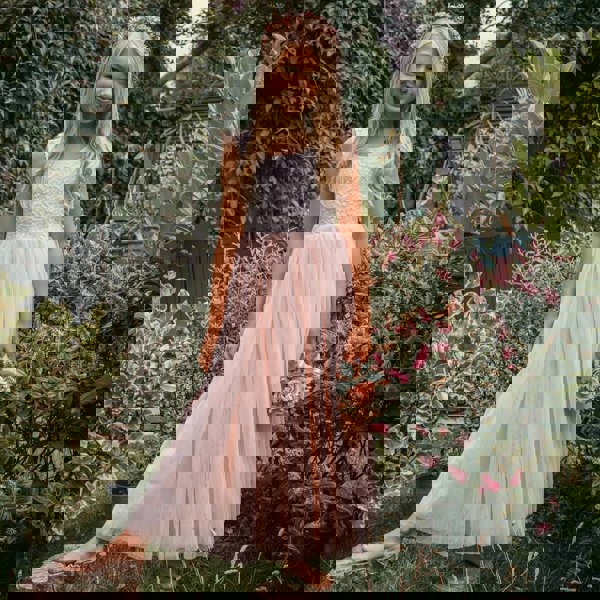 young flower girl in garden