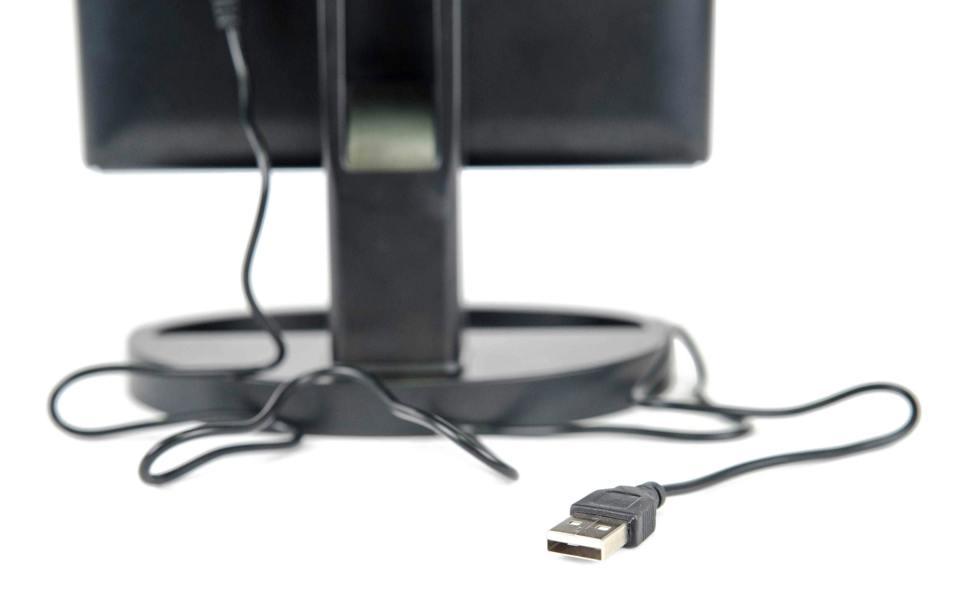 close up of USB charging cable plugged into rear or mirror