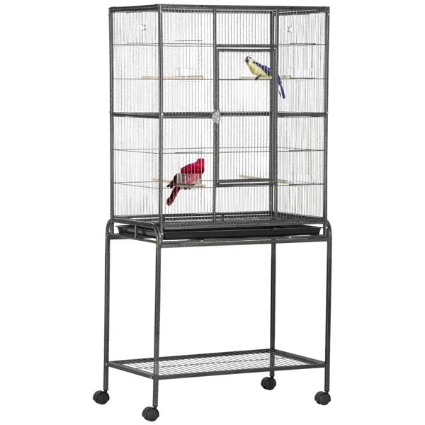 Black bird cage on stand with bottom wire shelf; two small colorful parakeets on perches