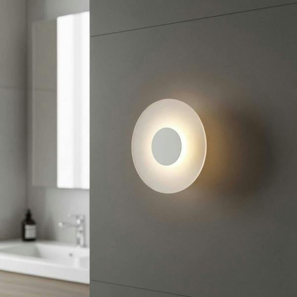 white IP65 bathroom wall sconce mounted on the wall in a modern bathroom 