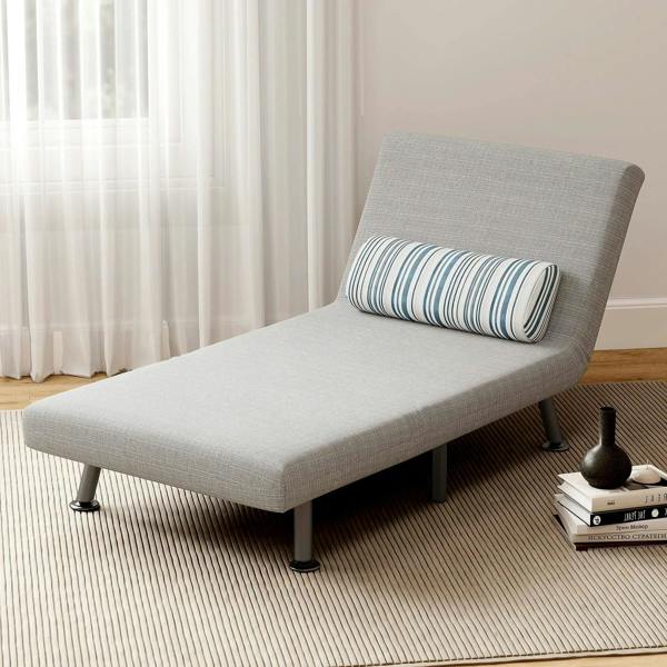 Light grey single sofa bed chaise lounge with striped pillow and tapered legs