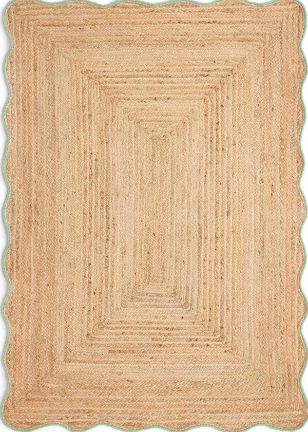 Beige braided rug on a white background