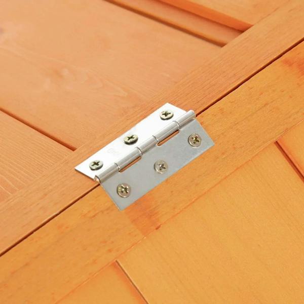 Metal hinge latch on orange wooden coop roof beam.