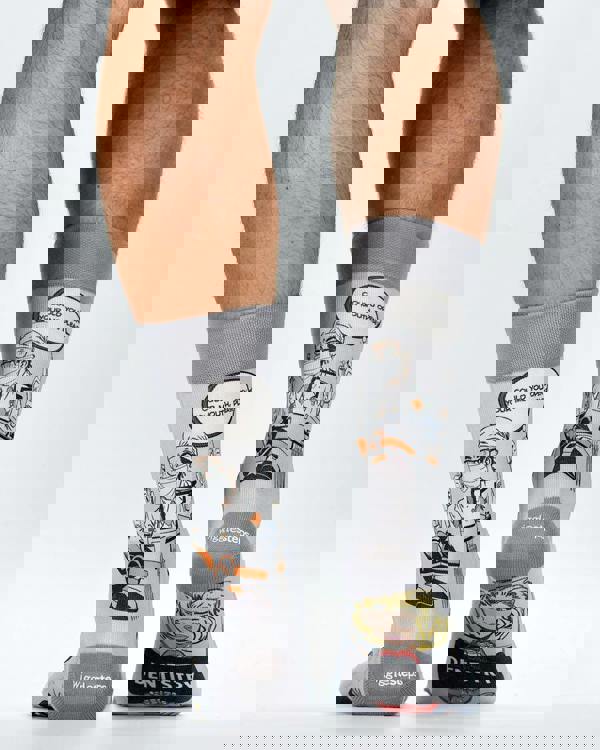 Gray socks with dental-themed designs and text on a white background