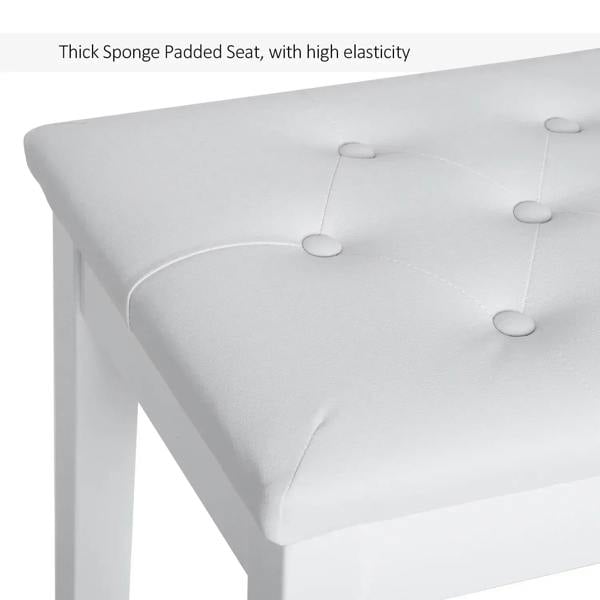 White tufted PU leather upholstered padded seat on a storage piano bench