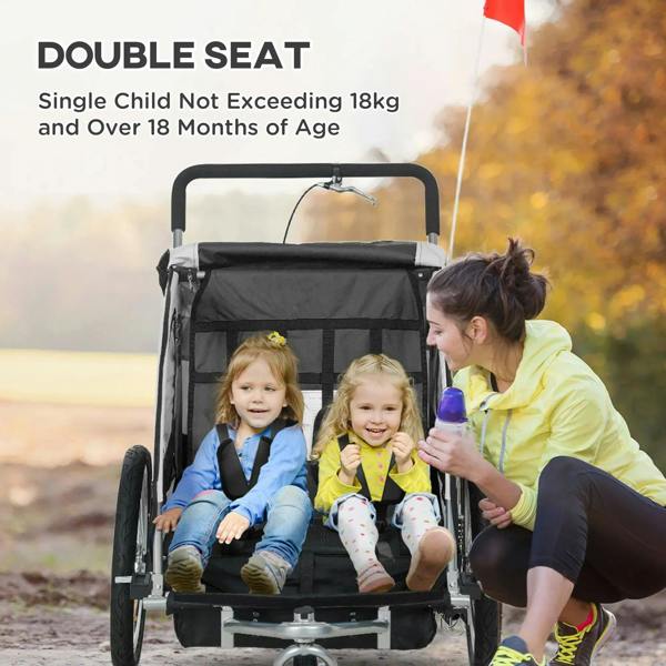 Black double-seat bike trailer with two child seats and front safety harness straps
