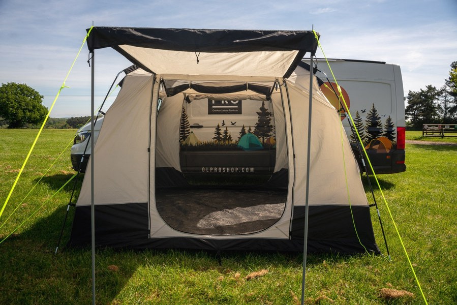 An image of the Cubo XL Motorhome Awning - Fibreglass Poles from OLPRO that is attached to a VW Crafter.