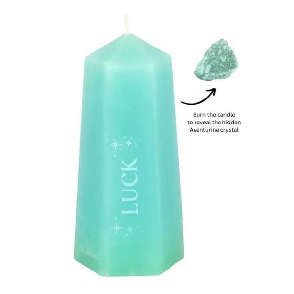 Luck crystal candle, mint green taper with rough green aventurine beside it