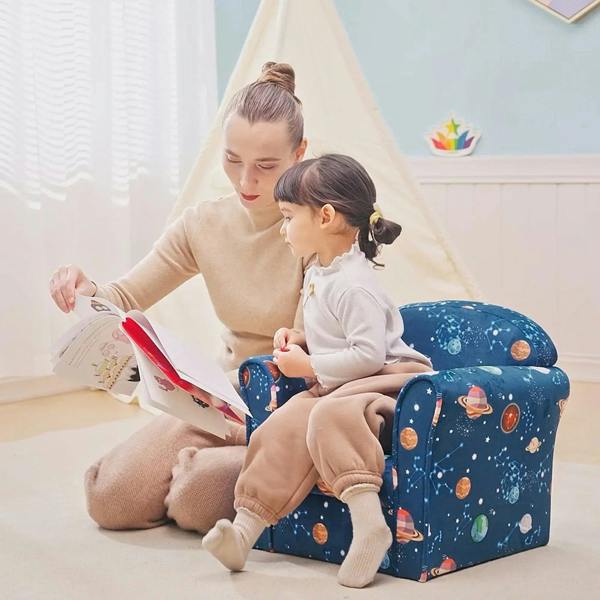 Blue space-print kids armchair with child seated upright and reading