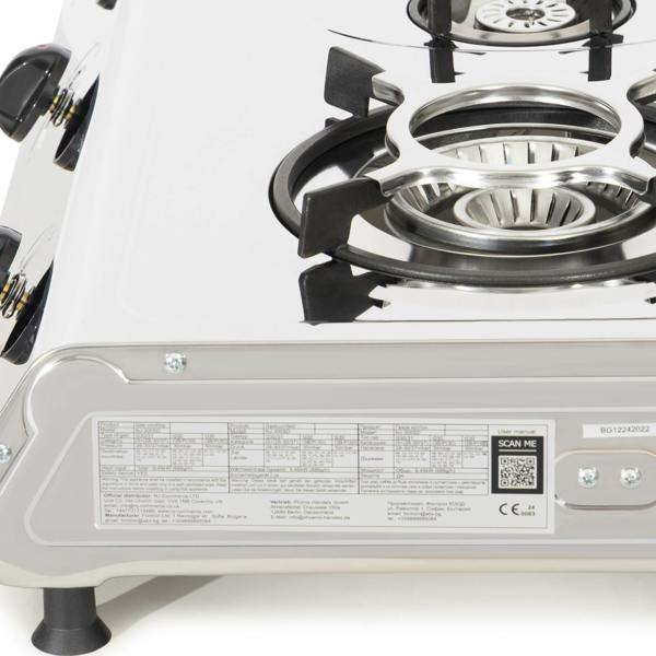 Close-up of a portable gas stove with visible branding and certification labels.