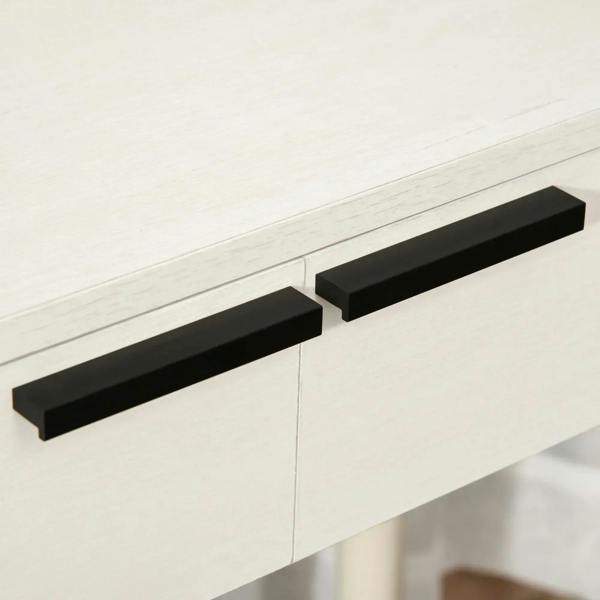Close-up of white vanity drawers with black bar handles