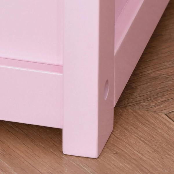 Pink wooden toy box bench corner leg on a smooth floor surface