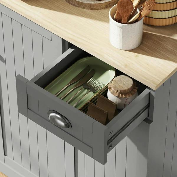 Grey kitchen cabinet pull-out drawer holding utensils and cookware on slide