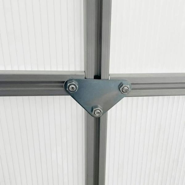 Silver polycarbonate greenhouse roof corner bracket with visible bolts on frame