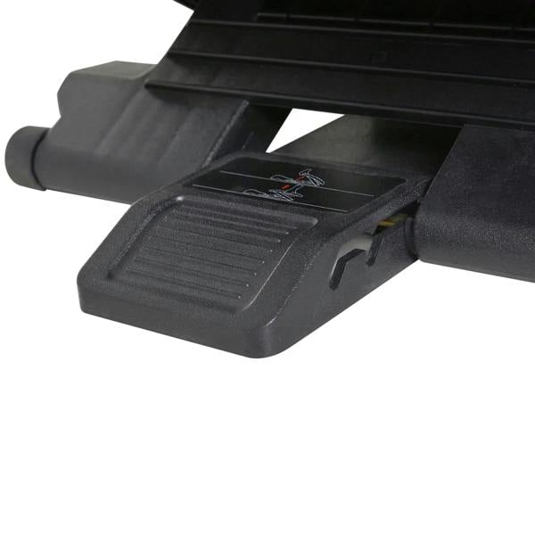 Black under-desk footrest with underside support plate and grippy tread pad.