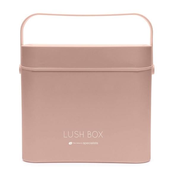 The Rio Lush Box Vanity Case - Large is a square, light pink storage case with a lid and handle, featuring LUSH BOX and the beauty specialists in white—ideal for chic beauty organization.