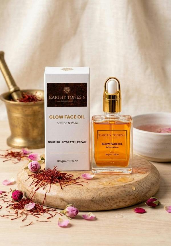 Earthy Tones 9 saffron and rose glow face oil packaging and bottle on a wooden board.