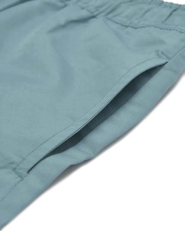 Lambretta Mens Swimming Casual Summer Shorts, close-up image of light blue swim shorts with a smooth fabric and tailored pocket design for summer wear.
