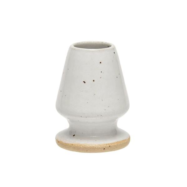 Matcha whisk stand on white background