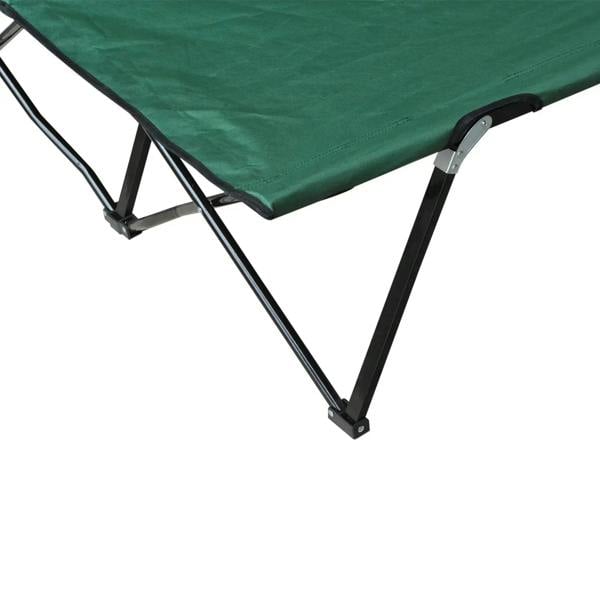 Close-up of green double camping cot corner with metal frame legs