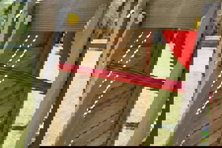 Climbing frame Rumble Ridge Rock Wall featuring single swing and slide - Best Shed