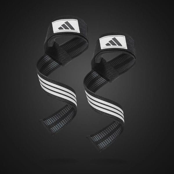 Black wrist wraps with white stripes and Adidas logo on a dark background