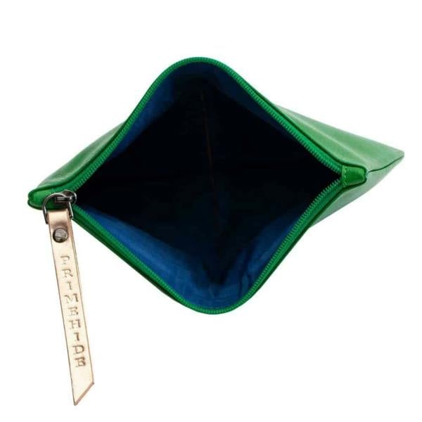 Interior of soft green leather makeup pouch for beauty essentials