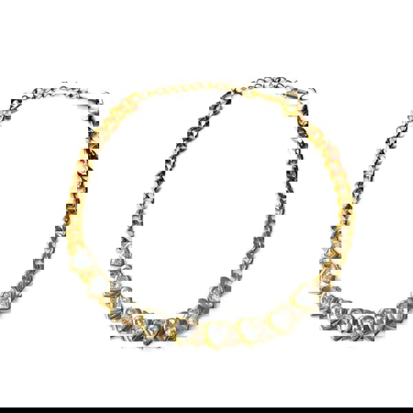 Gold necklace with heart-shaped gemstones on a white background