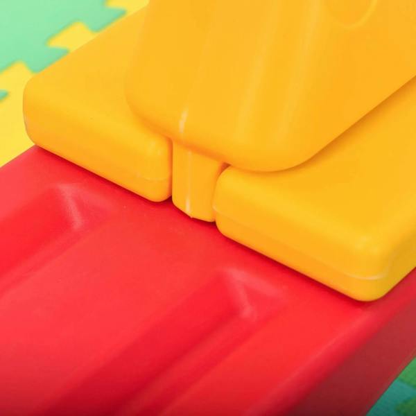 Yellow seat footrest on a red rocker board with molded supports